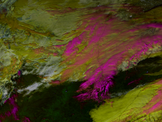 Clouds Stream Above a Snow Covered Central US